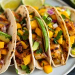 Sticky Mango Chicken Tacos With Avocado Slaw