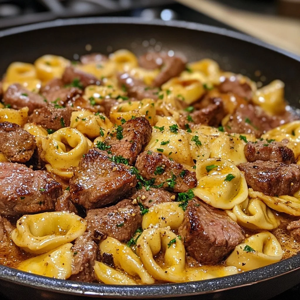 One-Pan Cowboy Butter Tortellini with Steak Bites on a plate