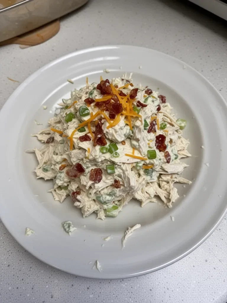 Delicious Million Dollar Chicken Salad served in a bowl with fresh ingredients