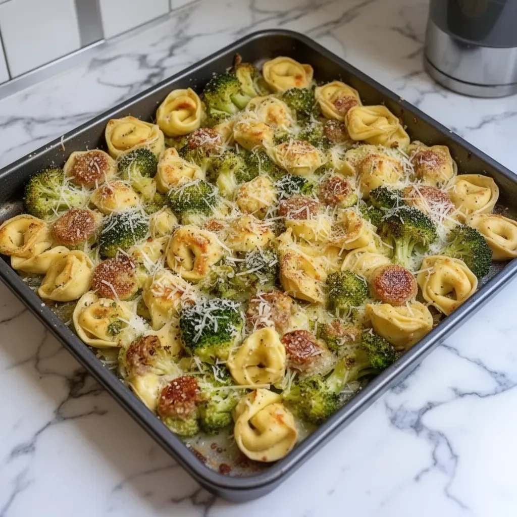 Sheet pan broccoli tortellini bake with cheese and fresh vegetables