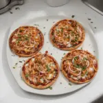 BBQ Chicken Pita Pizza topped with melted cheese and fresh vegetables