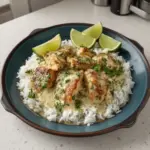Caribbean creamy lime chicken served with rice and fresh herbs