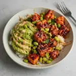Delicious Honey Sriracha Salmon Bowl garnished with fresh vegetables