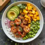 Shrimp Avocado Mango Rice Bowl with fresh ingredients and garnishes