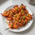 Sweet Chili Grilled Bang Bang Shrimp Skewers on a plate