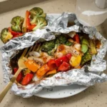 Delicious teriyaki chicken foil packet dinner with colorful vegetables
